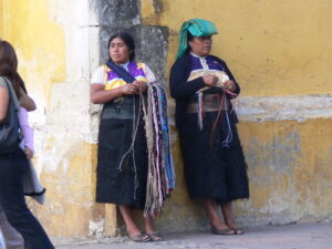 Tzotzil women selling woven items in a street in San Cristobal de las Casas. Photo by Wolfgang Sauber, Wikimedia Commons