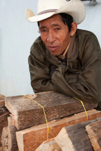Man selling firewood in Momostenango. DavidDennisPhoto.com