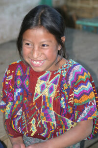 Girl in Momostenango wearing traditional huipil. DavidDennisPhotos.com